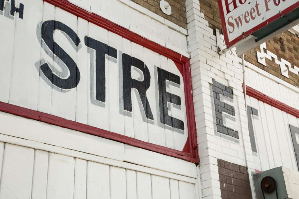 Known for its sweet potato pies, the long-established 27th Street Bakery at 2700 S. Central Avenue, also is distinguished by its red and white exterior and painted signage, done in all caps san serif black letters shadowed in gray.