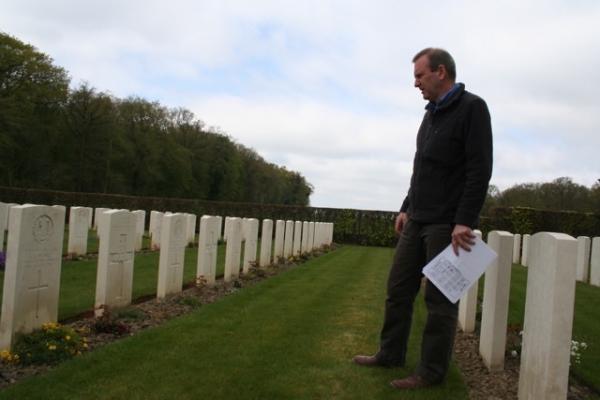 Military Historian Simon Jones in Dozinghem Cemetery outside Ieper, Belgium. Some of the first mustard gas victims from World War I are buried in this cemetery.