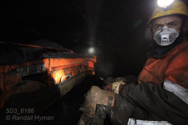 Miner works in depths of Mine 7 in Longyearbyen, Svalbard, Norway.