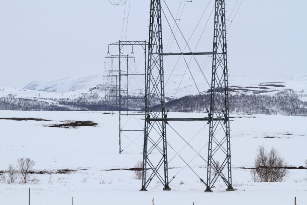 Power line cuts across winter reindeer pastures in Sennalandet, Finnmark County, Norway.