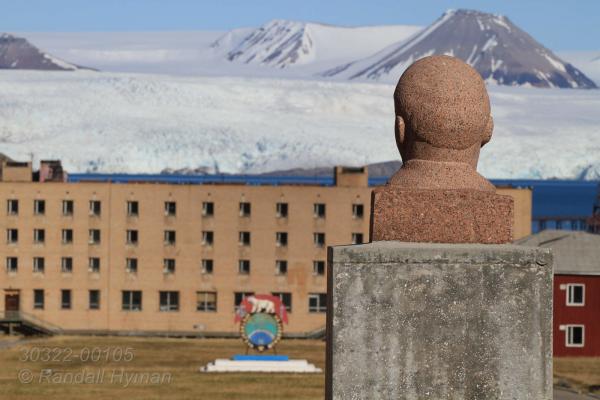 Lenin statue presides over the central plaza of the Russian coal mine ghost town of Pyramiden, once heavily subsidized as a model settlement and abandoned in 1998 at Isfjorden on Spitsbergen island; Svalbard, Norway.