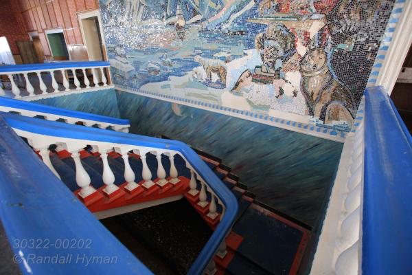 Mosaic of arctic scene graces grand staircase of canteen at the Russian coal mining ghost town of Pyramiden, once heavily subsidized as a model settlement and then abandoned in 1998; Isfjorden, Spitsbergen island, Svalbard, Norway.