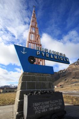Sign welcomes visitors to Pyramiden, the once-flourishing Russian coal mining town abandoned in 1998 at Isfjorden on Spitsbergen island, Svalbard archipelago, Norway.
