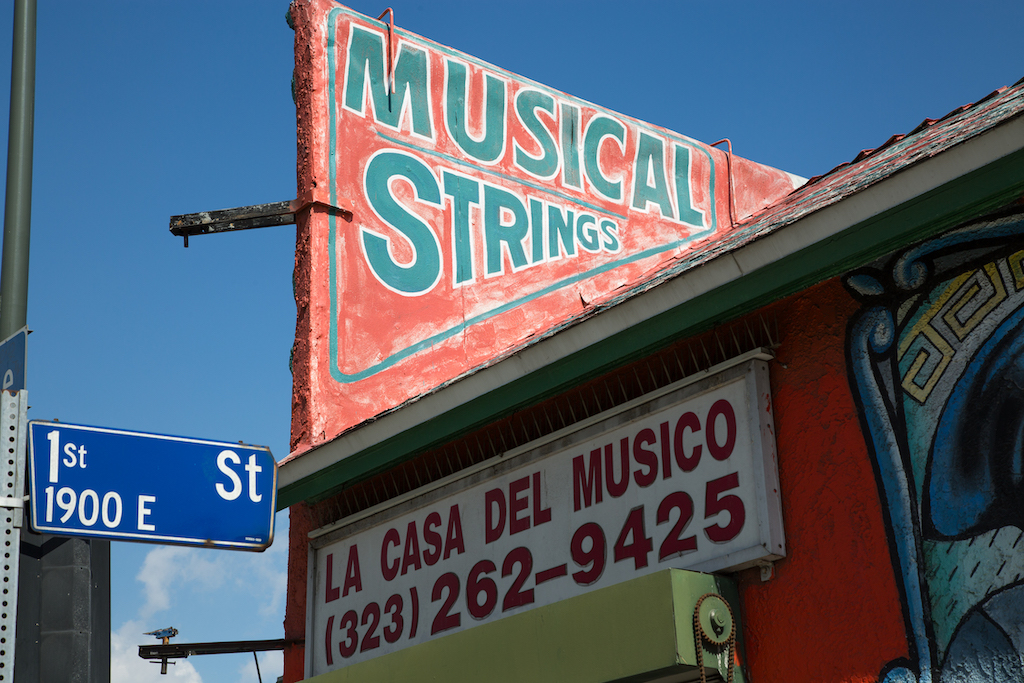 La Casa del Musico has been on the corner of First and State streets in East Los Angeles for 39 years. The sign letting passersby that it offers musical strings has been there about half that time.