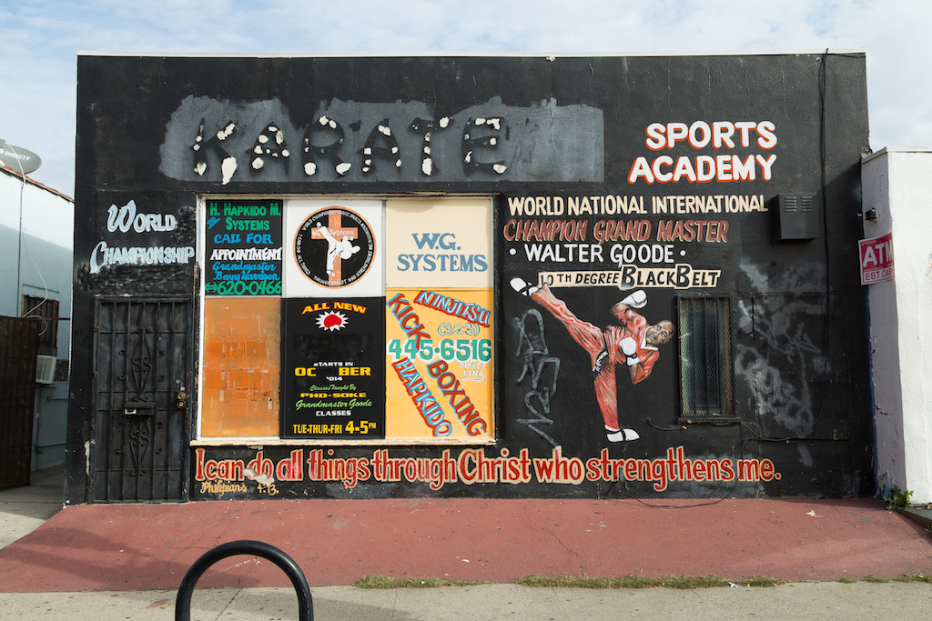 is action portrait was painted 11 years ago, and grandmaster Walter Goode still runs his Karate Sports Academy at 2025 W. Jefferson Boulevard, west of the University of Southern California campus.