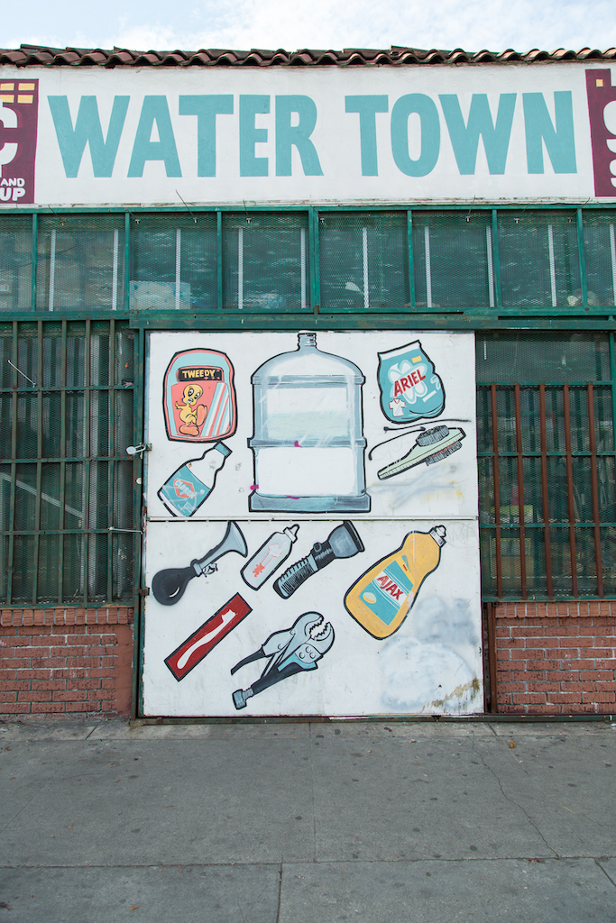 Water Town, at 2604 W. Jefferson Boulevard, is closed, but its hand-painted door depicting its inventory -- a water jug, dish detergent, flashlight, bleach, toothbrush and more -- lives on.