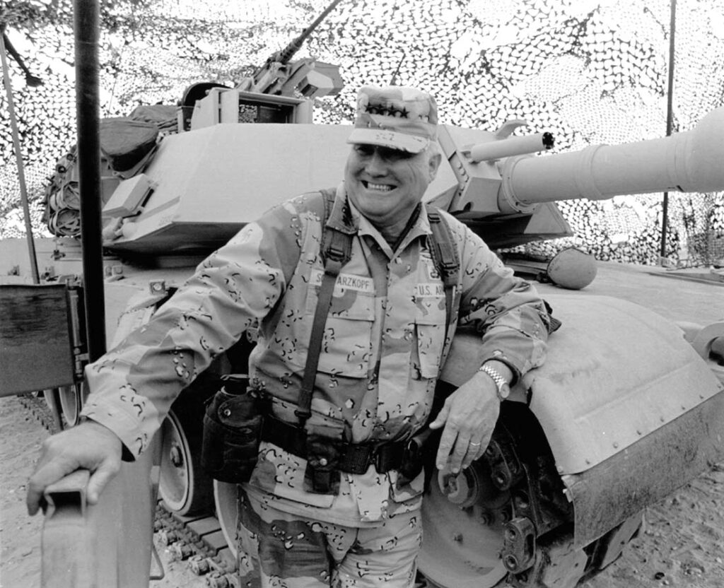 Gen. H. Norman Schwarzkopf is shown at ease with his tank troops at Operation Desert Storm in Saudi Arabia, January 12, 1991. (AP Photo/Bob Daugherty)