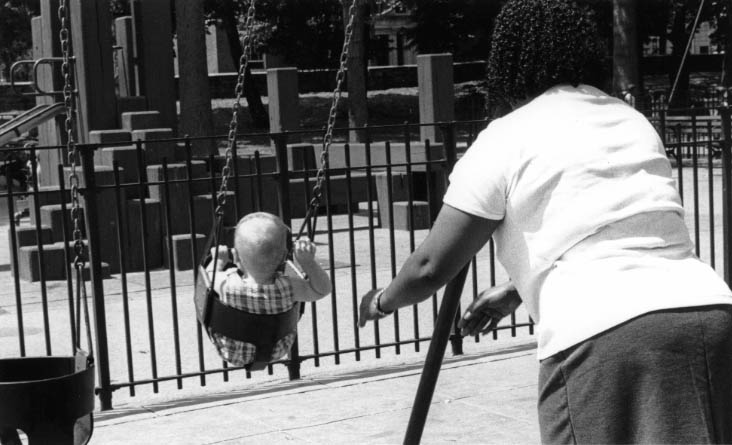 Jennitha Sampson, a Grenada-born maid, plays with her bosses’ child in a Brooklyn park. Photo by Jerrilyn Hedrington