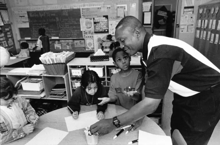 Low pay is the chief reason that so few African-American men are elementary school teachers. The emotional rewards are great, but the pay scale is poor. Photo by David Snider