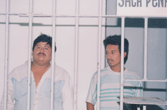 Jose Santos (left) and Salvador Valdez (right) in a Hidalgo jail this spring. These traveling stamp salesmen were falsely accused of kidnaping in rural Mexico. Photo by Jorge Muedano