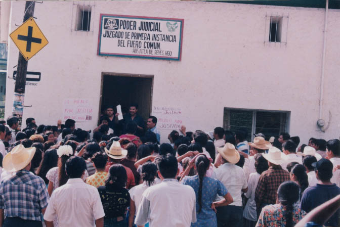 Holding the penal code in his hand, Judge Anastasio Hernandez tries to explain the law to the assembled crowd. Later Prosecutor Arturo Moreno does the same. Their efforts failed---a mob of 1,000 peple resulted in the two salesmen being lynched in the town square. Photo by Jorge Muedano