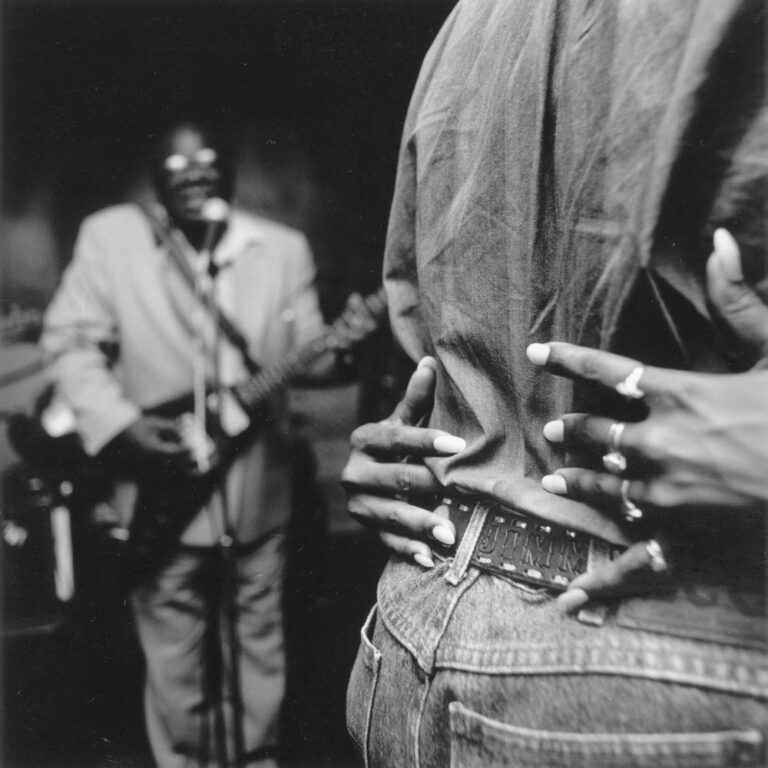 Greenville musician Little Bill Wallace inspires a couple to slow dance with a blues style reminiscent of his friend and contemporary B.B. King while performing at Boss Hall’s in Leland, MS in 1995. Club owner Boss Hall says he no longer can afford to pay live musicians to play at his club because of competition from casinos in nearby Greenville. “In fact, most of the time I can barely afford to pay the light bill in this place,” says Hall. “Sometimes I think it’s not worth opening at all.”