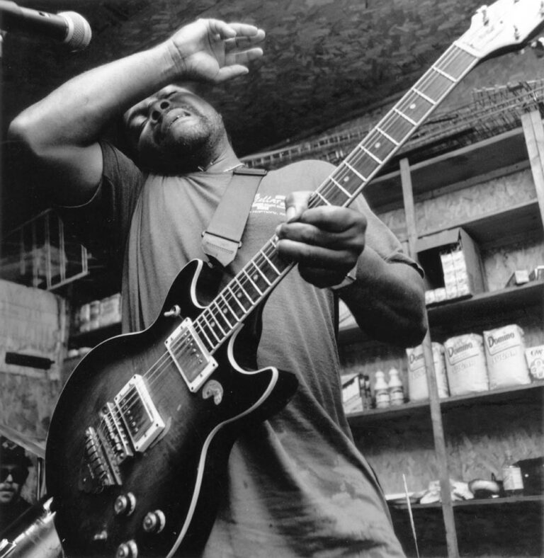 Blues singer/guitarist Lonnie Shields performs at Thompson grocery in Bobo, MS in late 1996. With limited opportunities for career advancement and an ever-dwindling number of juke joints featuring live music, talented young performers like Shields often leave Mississippi for the promise of the North, just as an entire generation of blues men did in the 1940’s and 50’s. Shields currently lives in Pennsylvania.