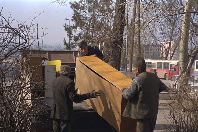 Workers move furniture from the city hall building in Ilidza, the most populous of the five Serb suburbs handed over to a Muslim-Croat federation as specified by the Dayton accord.