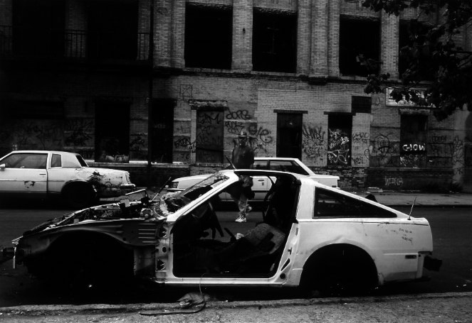 A stripped automobile sits abandoned near the Norwood subway station in south Brooklyn, New York. The neighborhood is home to a predominately low-income Latin community, including many former baseball players.