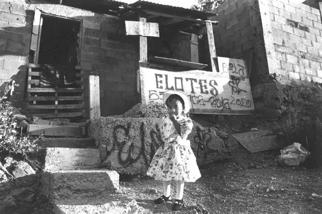 In Colonia Los Encinos, Lupita is dressed up for her third birthday party. The neighborhood is typical of Nogales, Sonora.