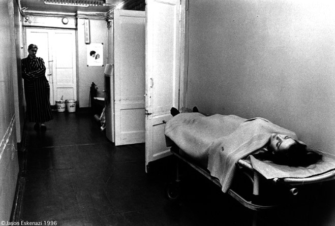 One girl waits her turn for an abortion, while another sleeps after her operation.