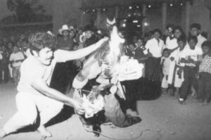Villagers burn a soldier’s effigy on Easter Sunday to continue to protest against the military massacre of 14 citizens of Santiago Atitlan on Dec. 2, 1990.