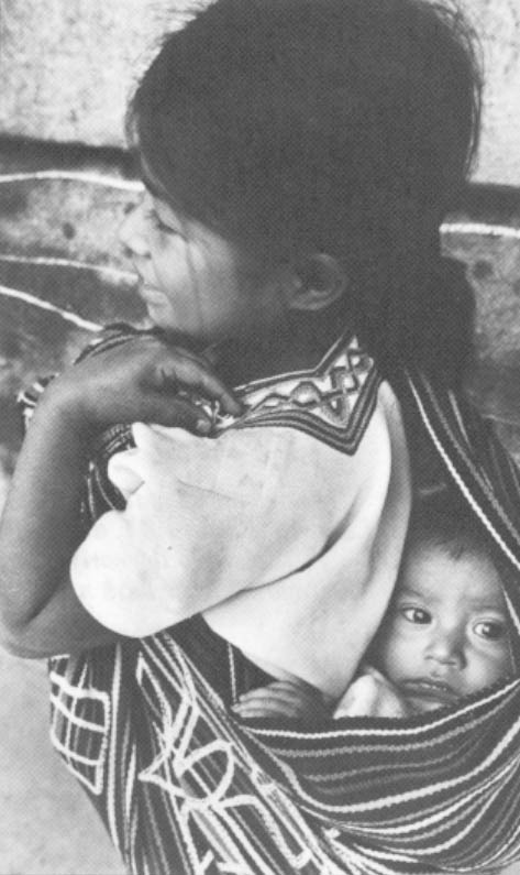 An infant and her mother wait for food at the government’s re-education center outside of Nebaj, Guatemala.