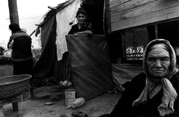 Women build shacks and try to carry on a semblance of life at an Azeri refugee camp.