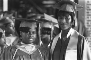 Lakesha Smith, left, and Annette Conley prepare to lead the Class of 1996 into the graduation ceremony at Rosa Fort High School. Conley was the class valedictorian and plans to attend Howard University in Washington this fall. Smith graduated an honor student and will attend Rust College, the oldest black college in Mississippi.