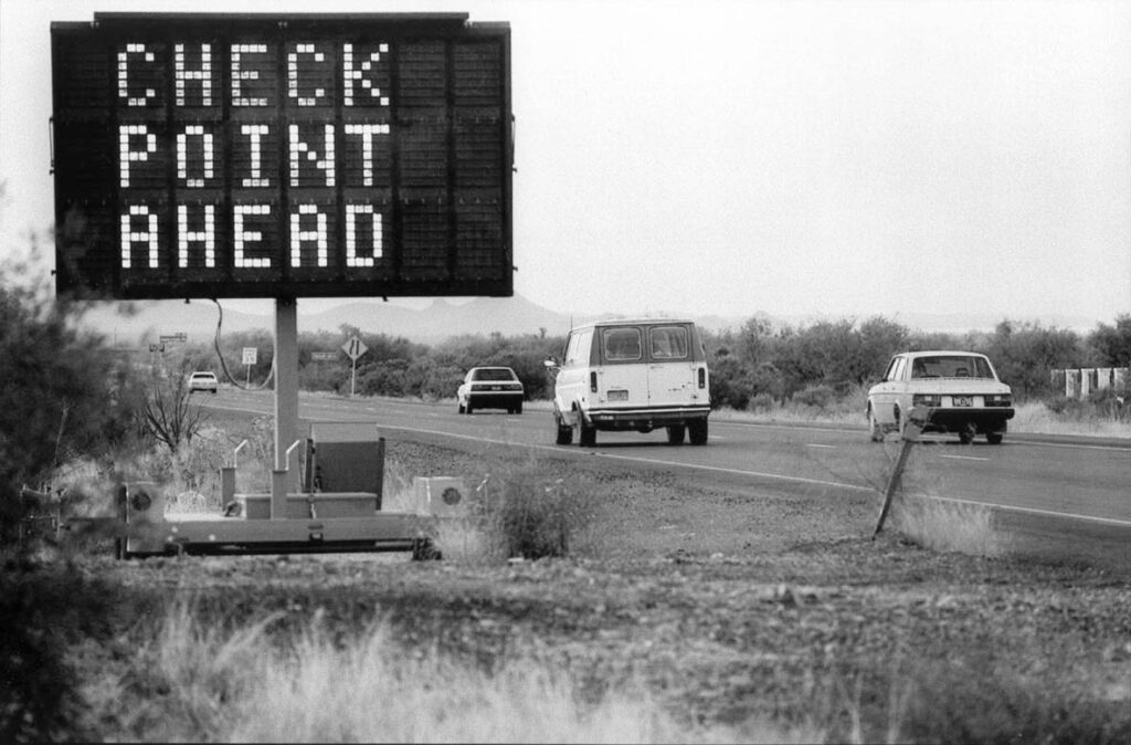 A portable sign warns motorists that they are approaching a Border Patrol checkpoint on Interstate 19 in southern Arizona.