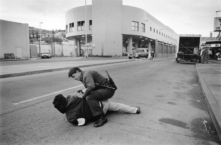 Border Patrol agent Sean Monroe takes down a Mexican national in front of the port of entry in Nogales, Arizona.