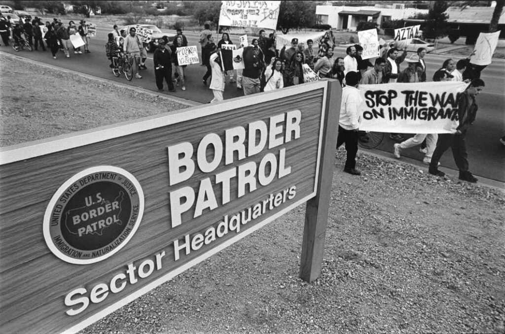 Protesters objecting to the crackdown on illegal immigrants march in front of the U.S. Border Patrol station in Tucson.
