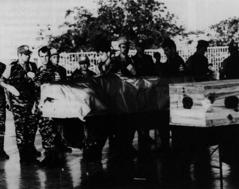 U.N. soldiers from Bulgaria carry the coffins of two of their colleagues in Phnom Penh, Cambodia, in April 1993. Photo by Peter Charlesworth, JB Pictures