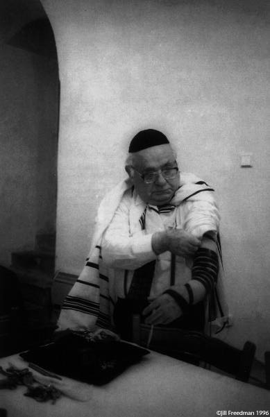Viktor Feuerlich is the only cantor remaining in the entire Czech Republic. He fled to Russia during the war and joined with Jewish partisans in the forest. He is tying on phylacterie, the portion of the Torah which orthodox men wear to pray in the morning.