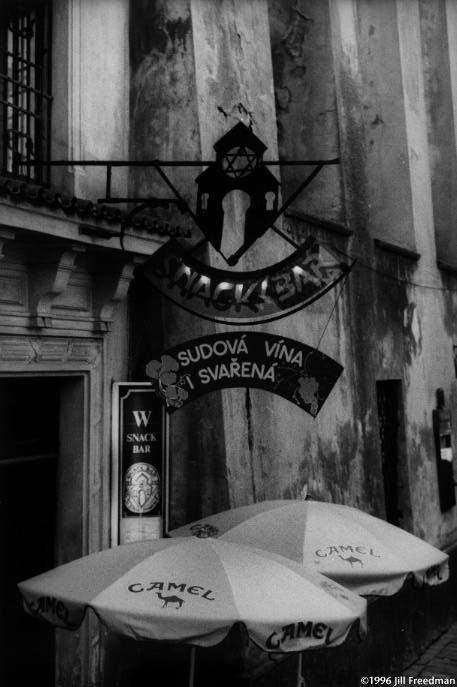 This Prague restaurant has nothing to do with the Jewish community, but the Jewish insignia marks it as a place for tourists to buy drinks and cigarettes, an exploitation of the past.