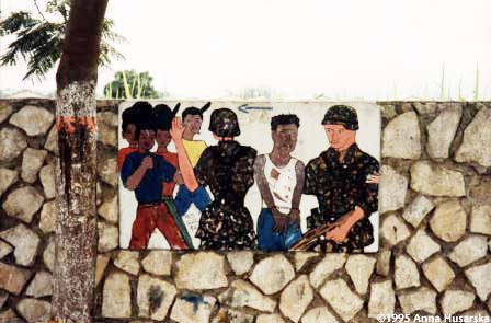 With 90 percent of Haitians illiterate, many a message is conveyed in painting. Here is an optimist's vision of how U.S. soldiers were going to arrest the bad guys, the thugs serving the de facto government.