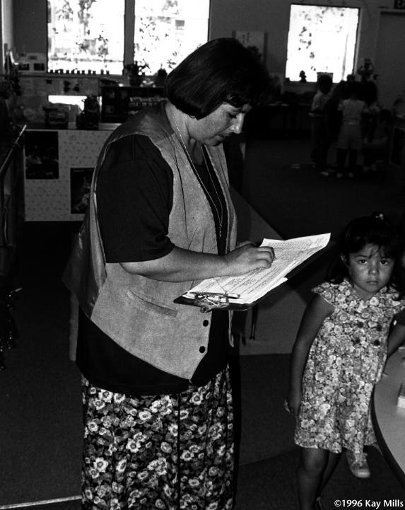 Ismelda Cantu, supervisor of the Westley Head Start center, checks attendance to make sure she has sufficient staff in each room. She is the child of migrant farm workers and was a former farm worker.