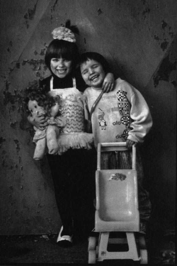 Megan and Melody are six-year-olds fraternal twins living markedly different lives with the virus that causes AIDS. The virus was passed on by their parents who are also infected. The tree remaining boys in the family are not infected. Photo by Randy Olson
