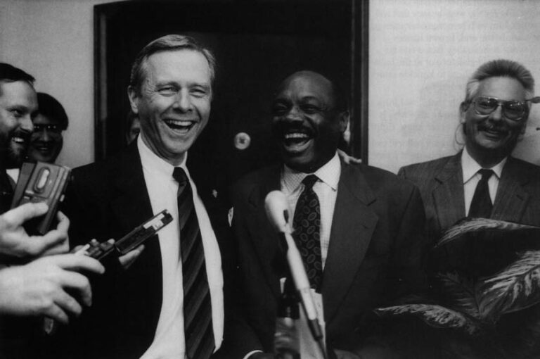 On the 23rd day of the impassee over adoption of the state budget in 1992, Speaker Willie Brown and Governor Pete Wilson finally started talking to each other again. The meetin gcame after Brown, uninvited, marched to the governor's office and asked to be let in. Facing reporters, Wilson put his arm around Brown and called him "my pal." The budget impassee - over education - continued, however, lasting a record-breaking 64 days. Photo by Rich Pedroncelli