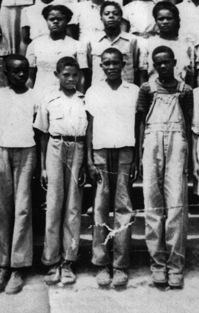 The "ie boys" in Mineola, Texas, in 1947, so-called because of their nicknames ending in ie. From left to right, Willie (Brookie) Brown, Frank (Jackie) Crawfor, Clarence (Cookie) Slayton, and Edward (Bootie) Dickie. Photo courtesy of Virginia London McCalla