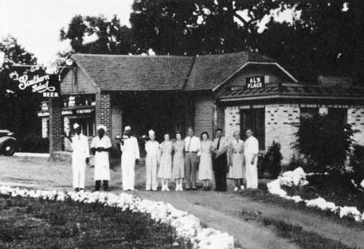 Al's Place in Mineola,from a 1936 Postcard marking the Texas Centennial. Willie Lewis Brown, father of Assembly Speaker Willie Brown, is third from left standing at attention in a white duck jacket. In an interview 57 years later, he said he remembered holding the tray that day. "I wanted to have something in my hand to show I was a waiter."