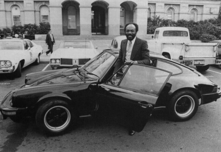 In 1976, Willie Brown wanted to sell his latest Porche, showing it off on the State Capitol grounds. Brown's reputation for flamboyance and living the high-life took off in the mid-1970s. Photo by Owen Brewer, Sacromento Bee, courtesy of City of Sacramento Archives and Museum Collection Center.