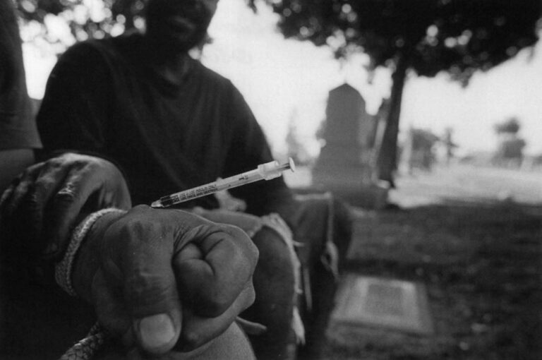Steve helps another addict shoot heroin in the Evergreen Cemetery in Los Angeles.