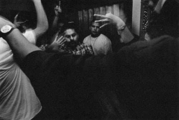 Evergreen Boys dance at a house party.
