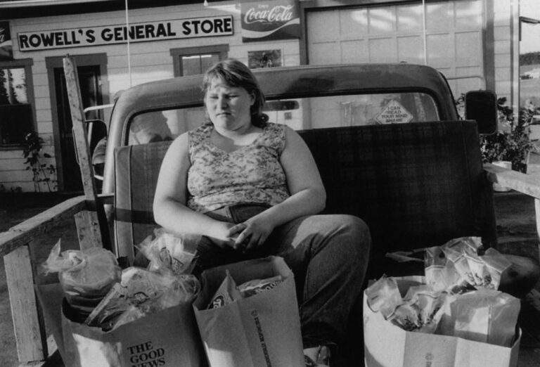 Mare Foss rests after stocking up on food at the general store in nearby Athens.
