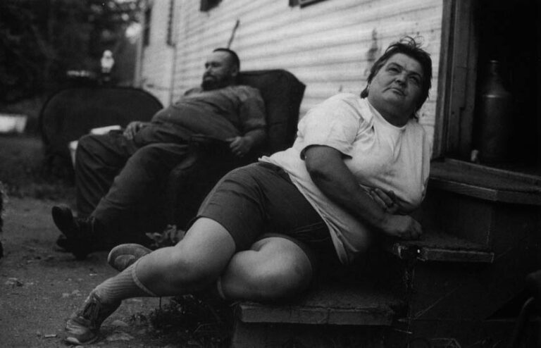 Rena and Everett York sit outside their trailer in West Athens. They live on borrowed land and haul water from a well. Lumber's demise has meant a spartan life for the couple.