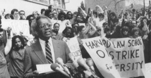Harvard Law School professor Derrick Bell addresses a rally at the law school, threatening to take a leave of absence if the school did not give tenure to a black woman. AP/Wide World Photos