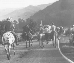 In an annual tribute to early settlement, a wagon train moves into Tatham Gap, outside Andrews, North Carolina. Some of the road ahead is dirt, though much improved since thousands of Cherokee Indians were herded along it in 1838, on the first 12 miles of the Trail of Tears.