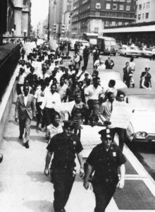 Hundreds of youths marched on Lexington Avenue on July 17, 1964 to the 67th Street police station to protest the death of James Powell, who was killed the night before by a police lieutenant. Photo by AP Wide World Photos