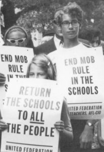 Some 15,000 striking New York teachers and their supporters circled City Hall with pickets during a September, 1968 rally...sparked by "decentralization" efforts supported by the Ford Foundation. AP/Wide World Photos