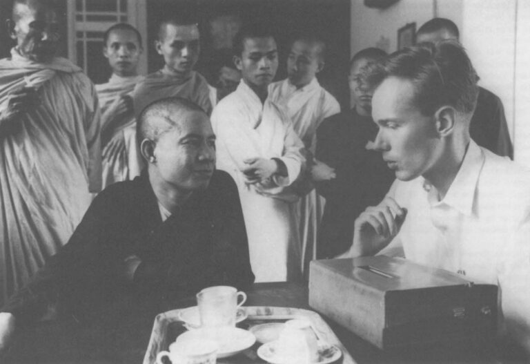 Malcolm Browne of Associated Press interviews Quang Lien, spokesman for the protesting Buddhist monk's in Saigon, in June 1963. Wide World Photos, Inc.