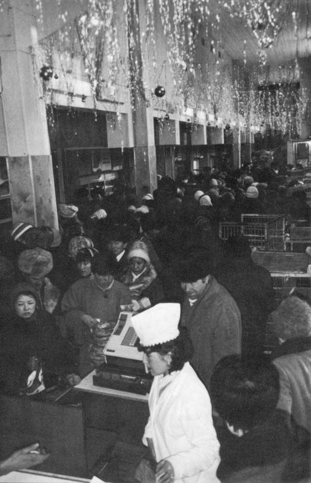 Residents of Alma-Ata, Hazakhstan crowd inside a bread shop.
