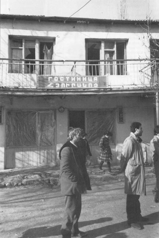 Shaumyan residents stand in front of a sports club in the center of town that was destroyed by a Azeri missile attack.