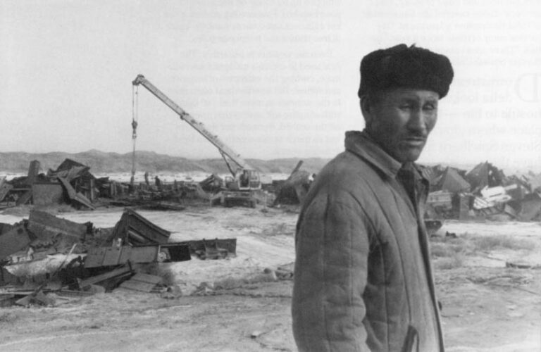Uspan Gorbanbayev, a former fisherman now guards Muynak’s ship cemetery against pilferers. The cemetery is on the former seabed near Muynak, where workers from the fish cannery chop up the towns former fishing boats. They barter the scrap for tin to make cans to hold the. now imported fish.
